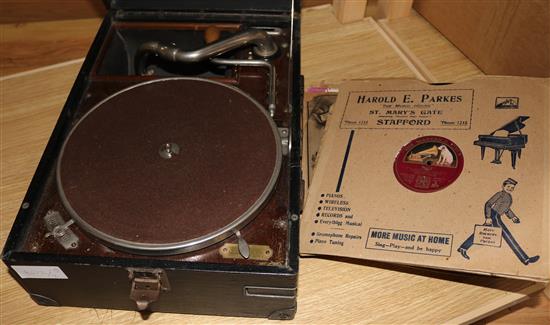 A wind up gramophone and records